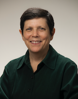 A headshot of Amy Klion in a green shirt.