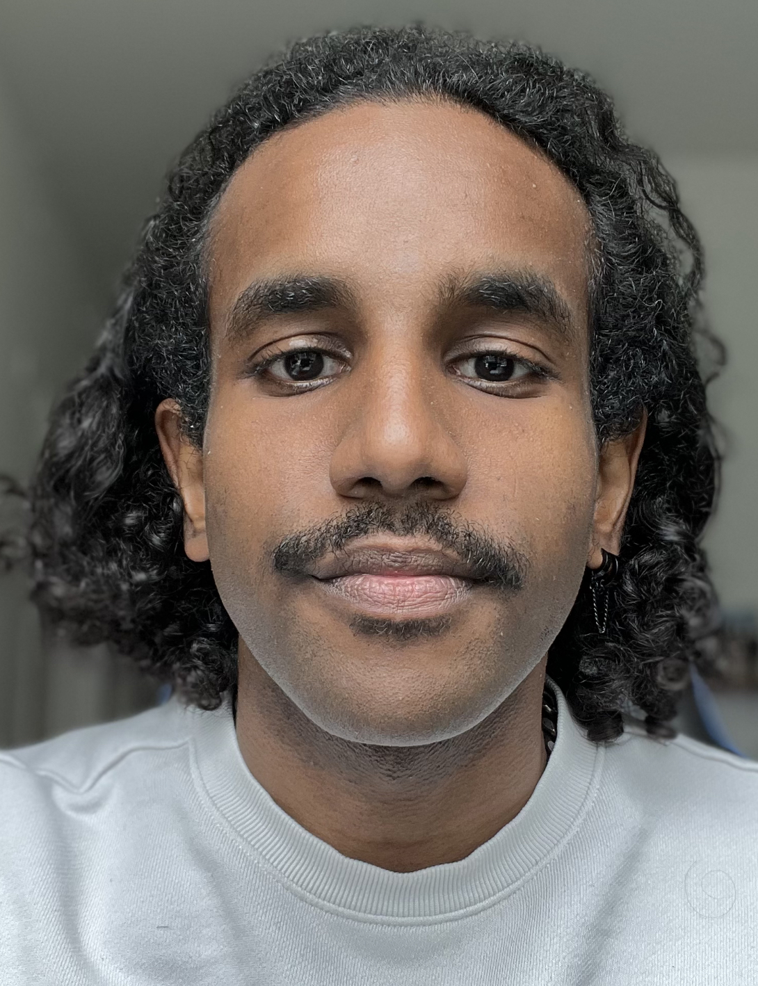 headshot of Amjad Omar Elhassan