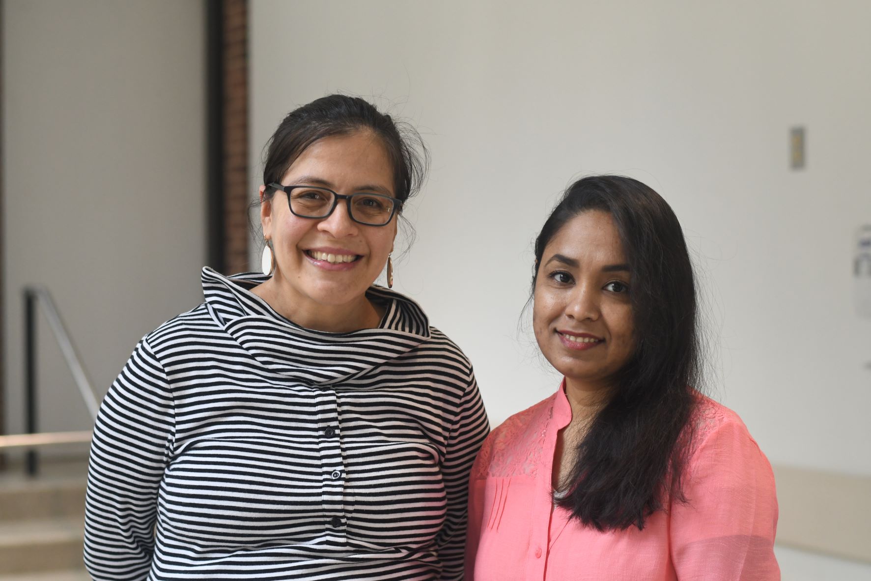 Idalia Yabe and Sharmina Deloer standing next to each other