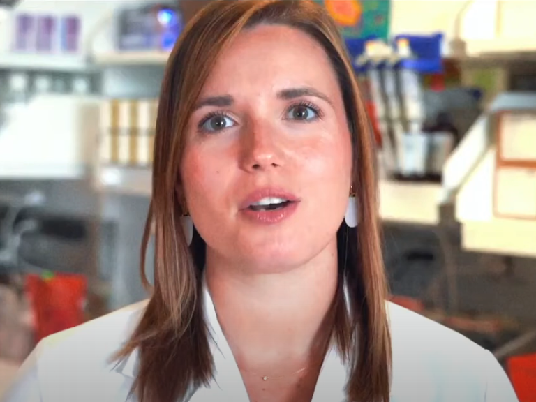 woman speaking in a lab