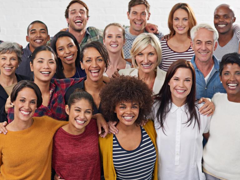 a group of smiling diverse people