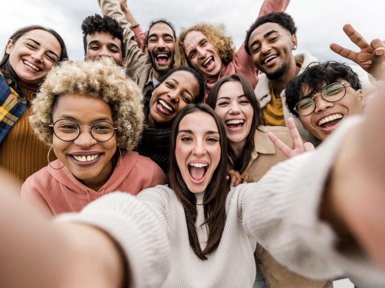 Selfie photo of multiple smiling volunteers