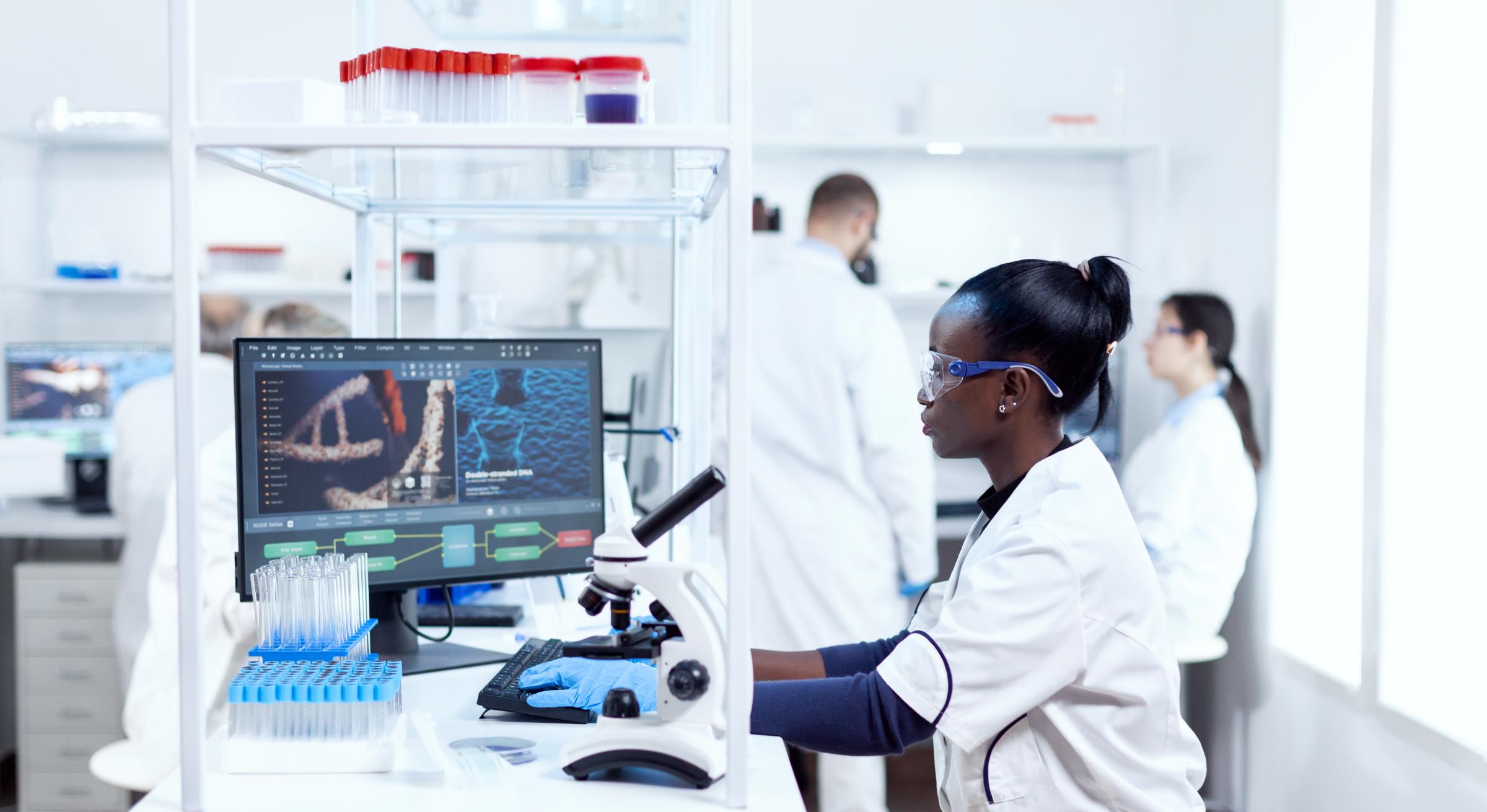 Concentrated researcher using a computer in modern facility