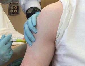 clinical trial volunteer receiving vaccine 