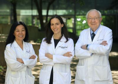 Three doctors in white lab coats.