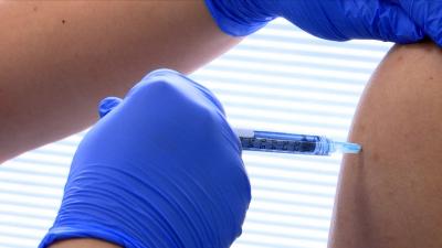 close up of vaccine needle in arm