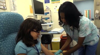 PASLI/APDS patient with nurse at NIH