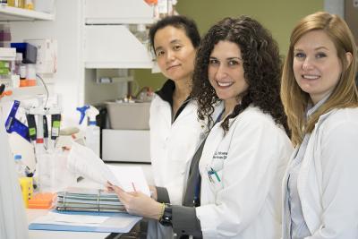 Image of three women scientists in a lab