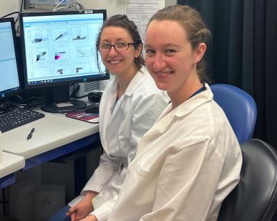 Abigail Wukitch and Andrea Luker in a laboratory.