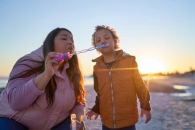 mother and baby blowing bubbles