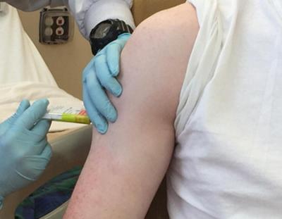 clinical trial volunteer receiving a vaccine