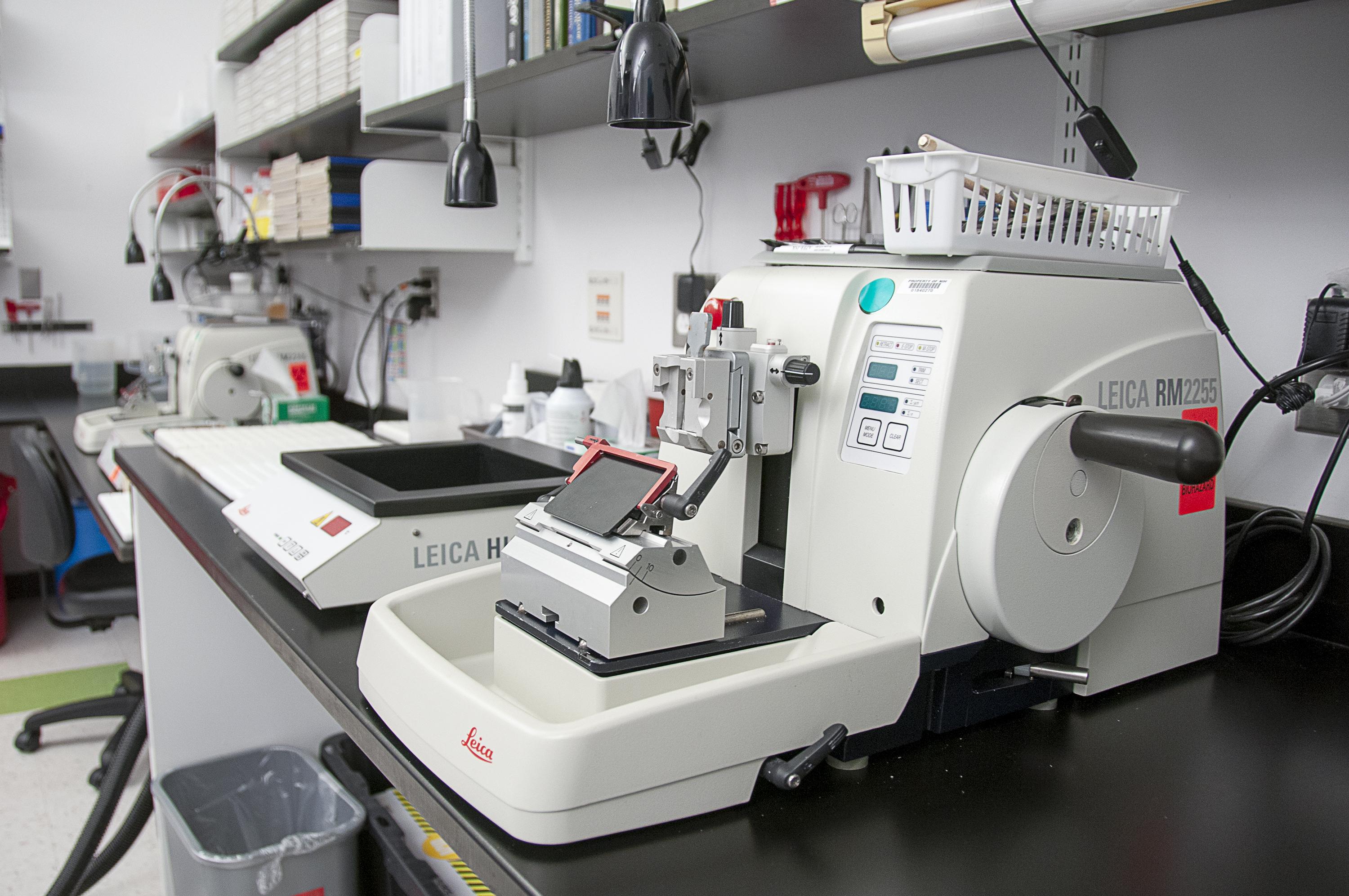 Leica Biosystems HistoCore-MultiCut standard semiautomated rotary microtome and HI1210 lighted thermoregulated water flotation bath instrument.