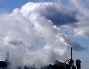 Photo of air emissions at an urban manufacturing complex.